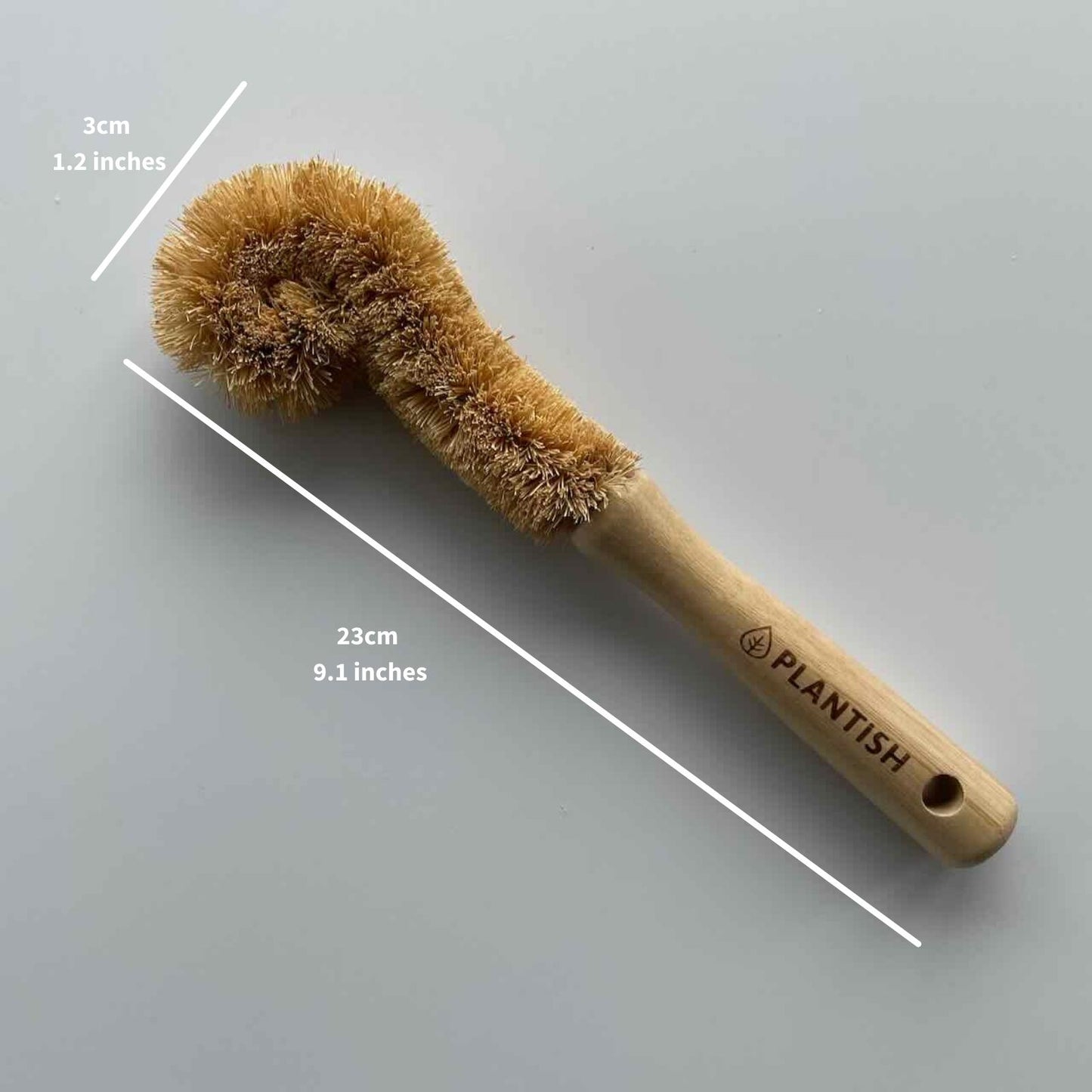 coconut bottle brush shown in dimension. 23cm length, and 3cm in width.