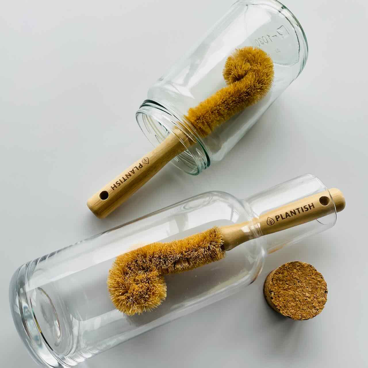 coconut bottle brushes inside different glass bottles