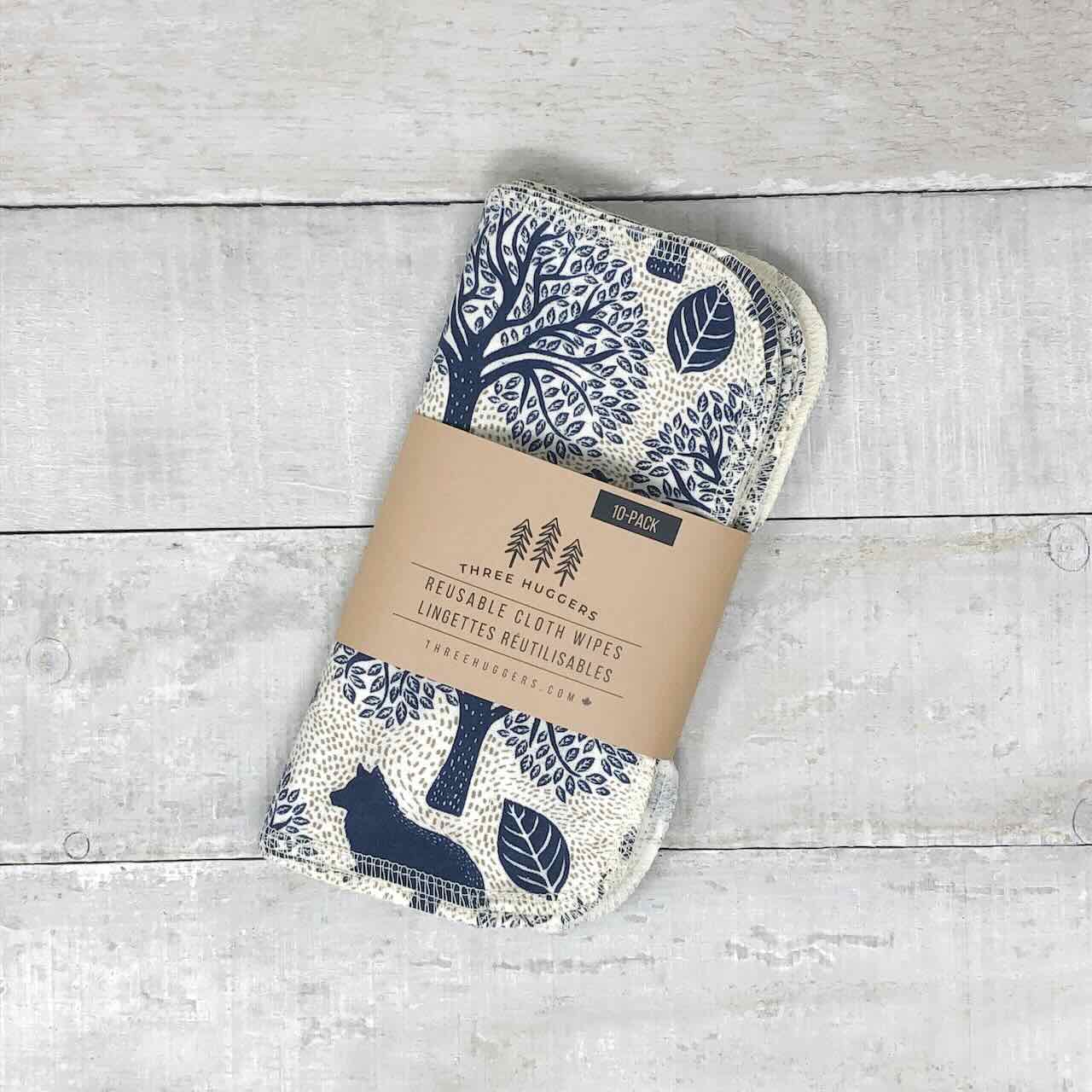 A set of 10 reusable cloth wipes in its paper sleeve, with elegant forest animals printed on the fabric.