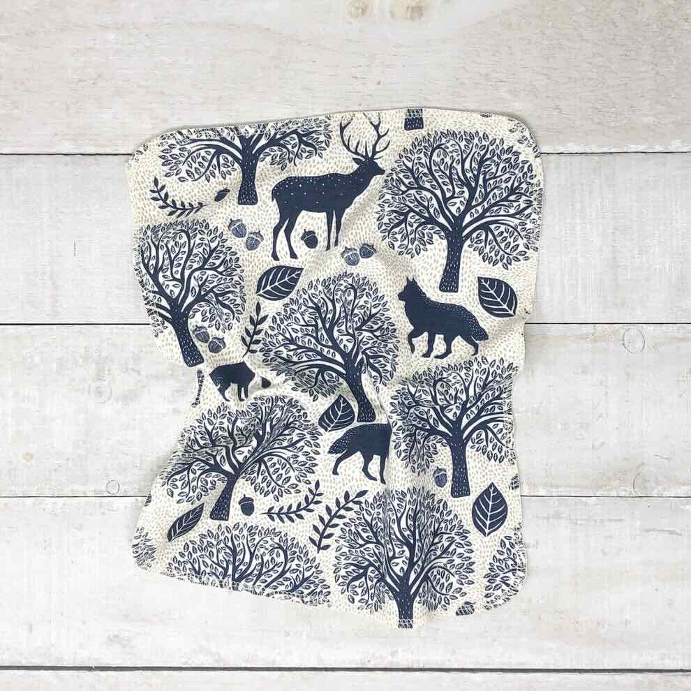 Forest animal patterned cotton towel on a table