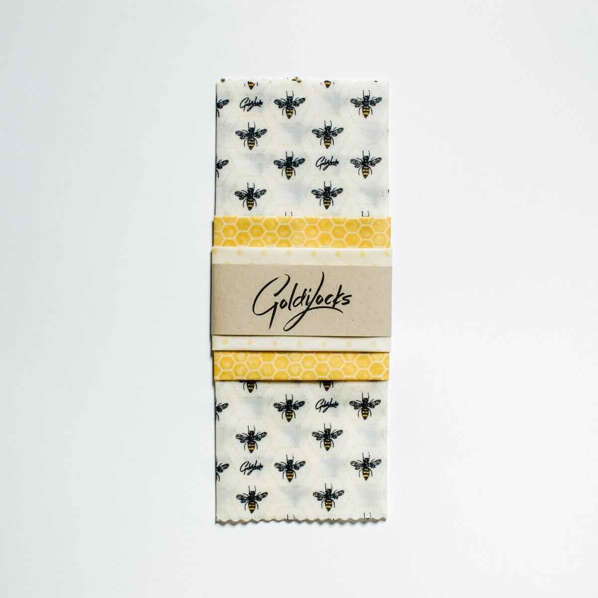goldilocks bees and honey comb themed beeswax wrap flat lay