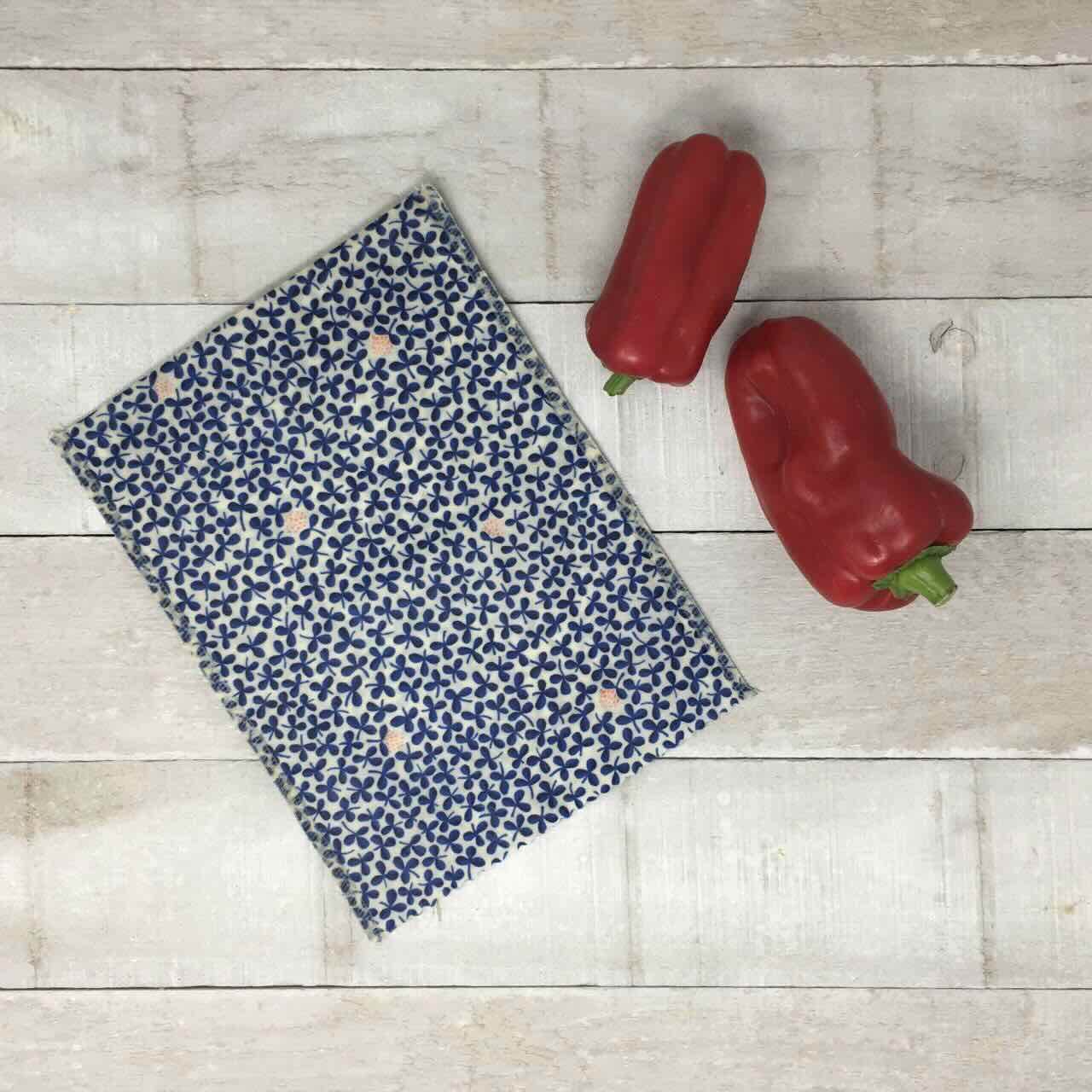 blue open beeswax wrap with red pepper