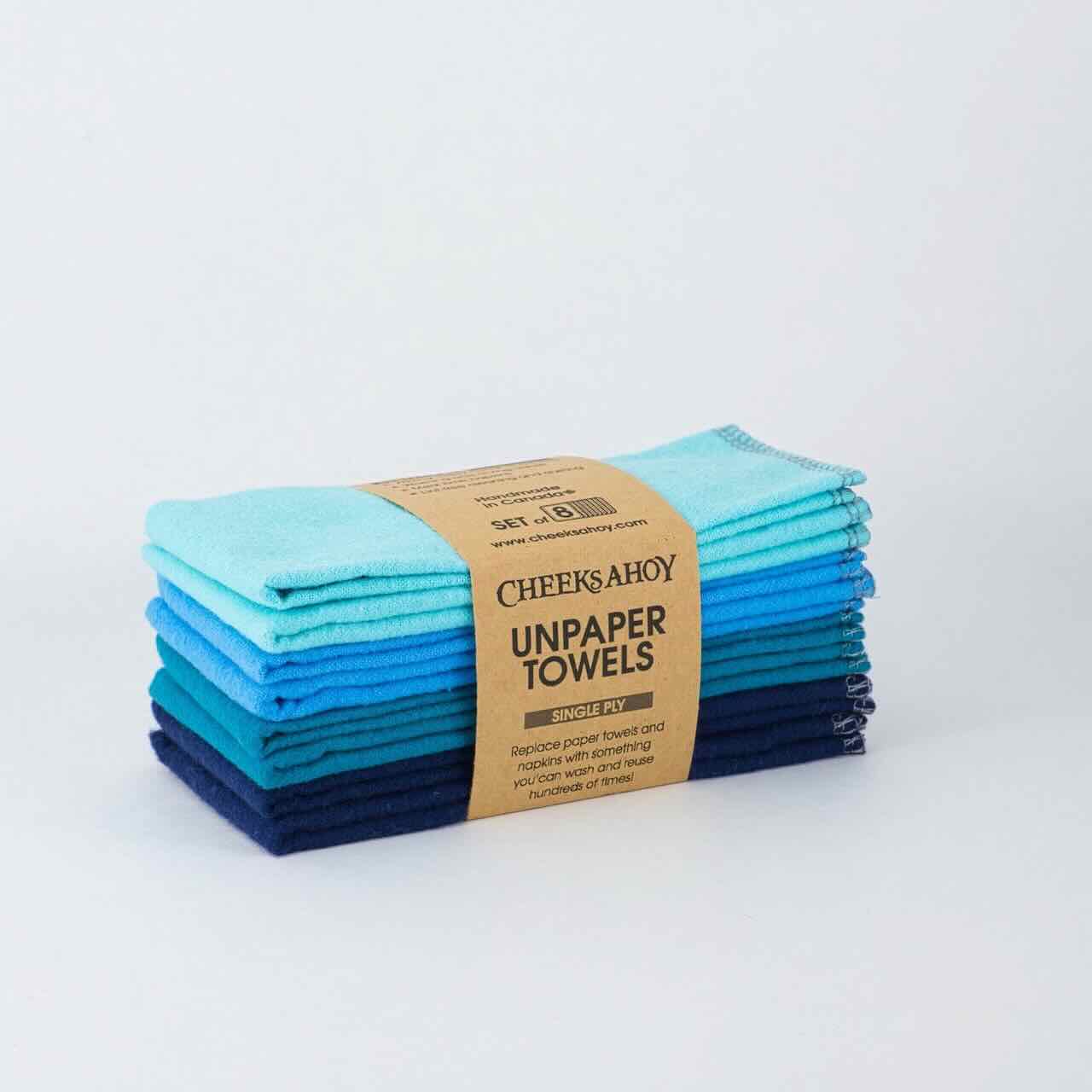 cheeks ahoy different shades of blue of unpaper towels set of 8 on top of a plain table top.