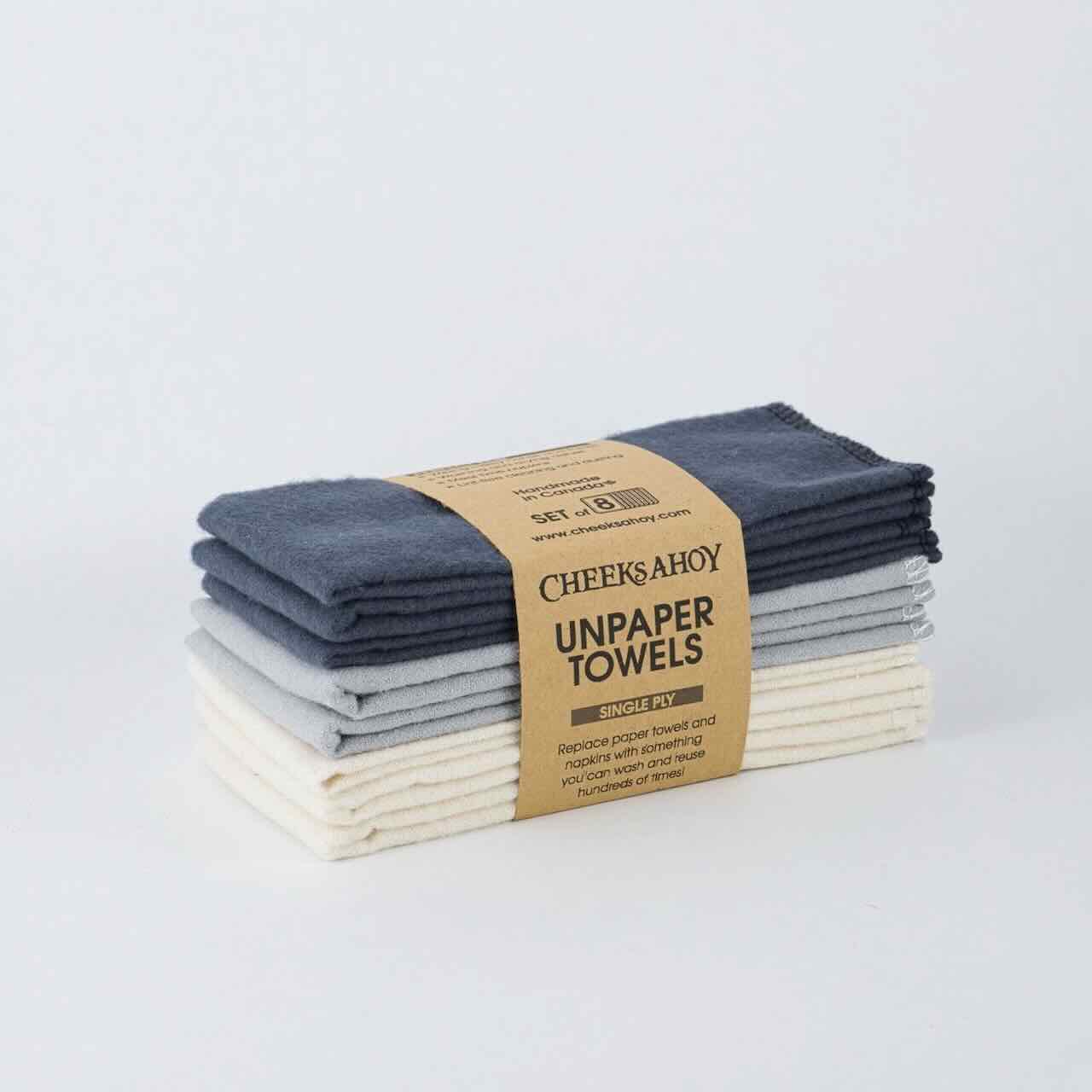 cheeks ahoy warm charcoal unpaper towels set of 8 on top of a plain table top.