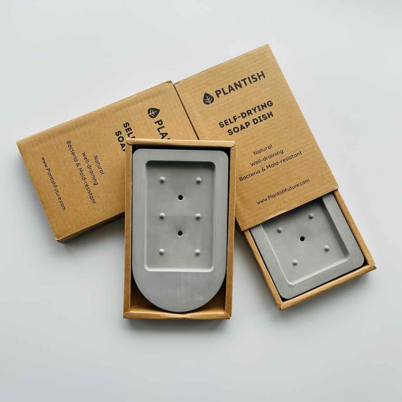 Eco friendly soap dish trays in their packaging laid on a table top