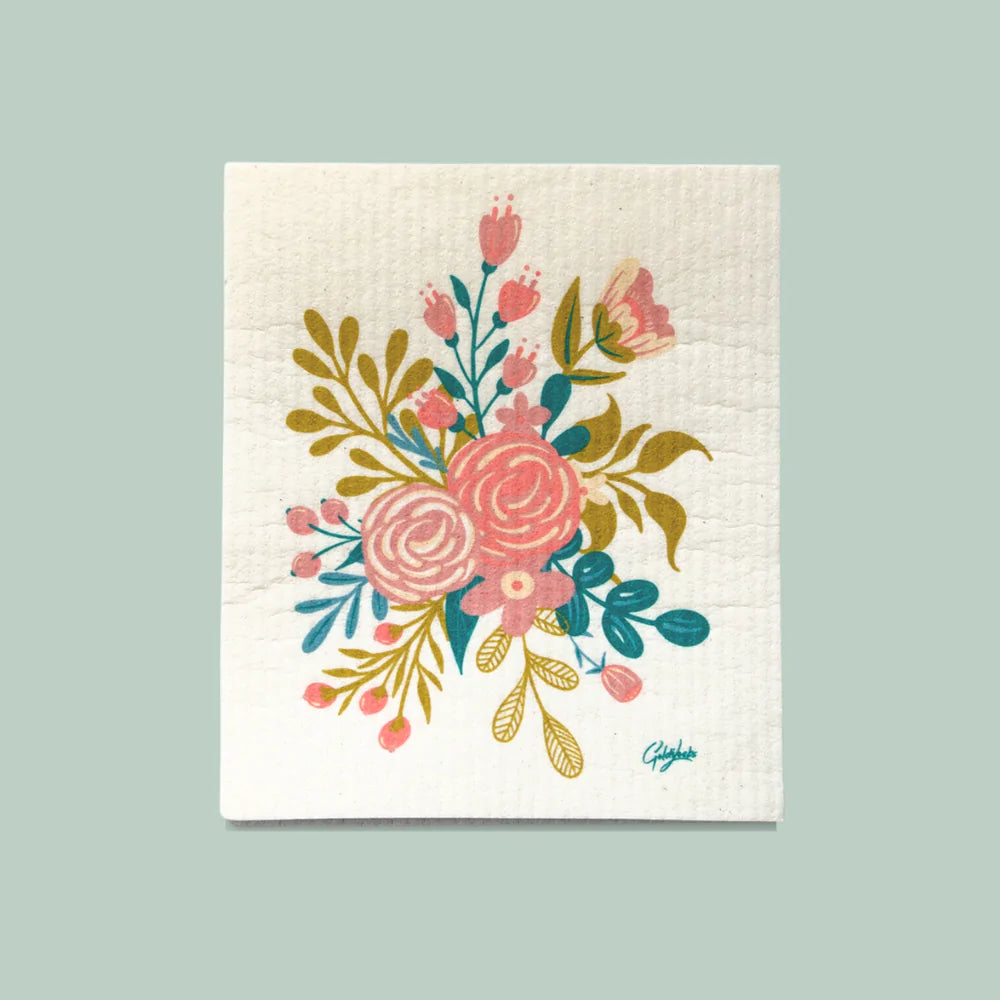 Close up of a goldilocks dishcloth displaying a densely packed floral bouquet 