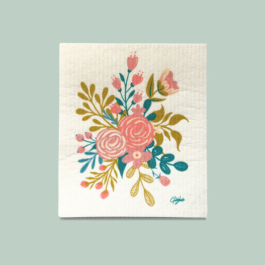 Close up of a goldilocks dishcloth displaying a densely packed floral bouquet 