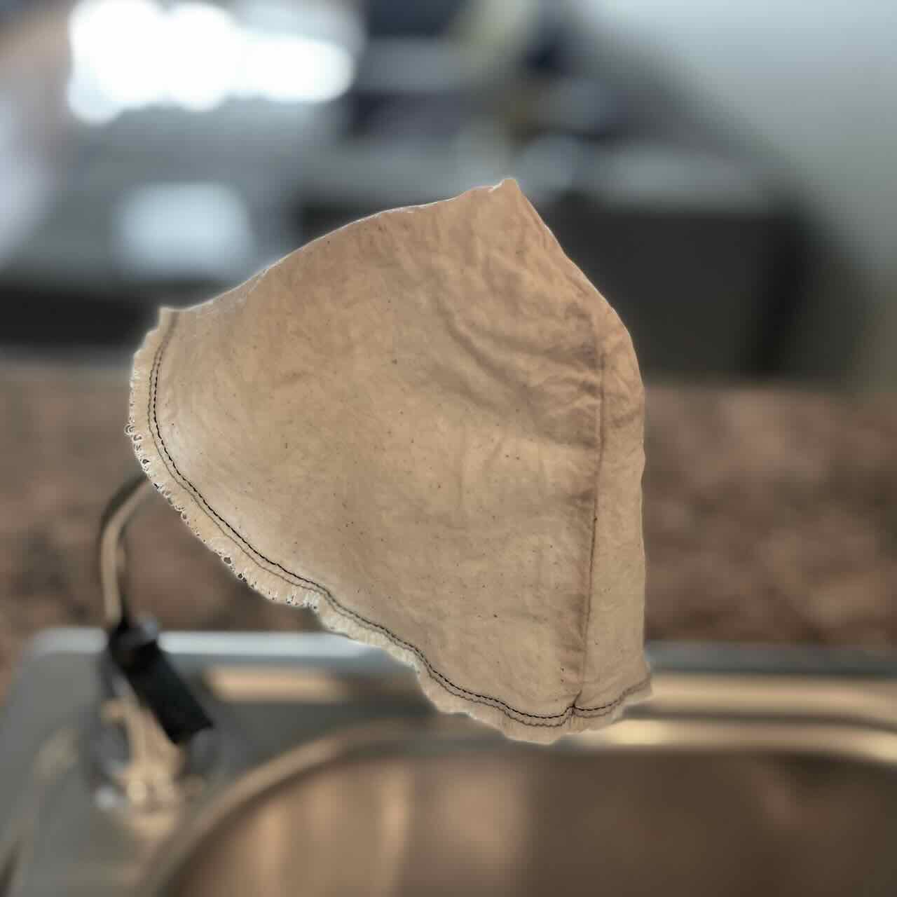 A washed coffee filter on a sink