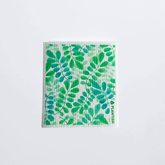 swedish dish cloth silver dollar patterned on a white table top