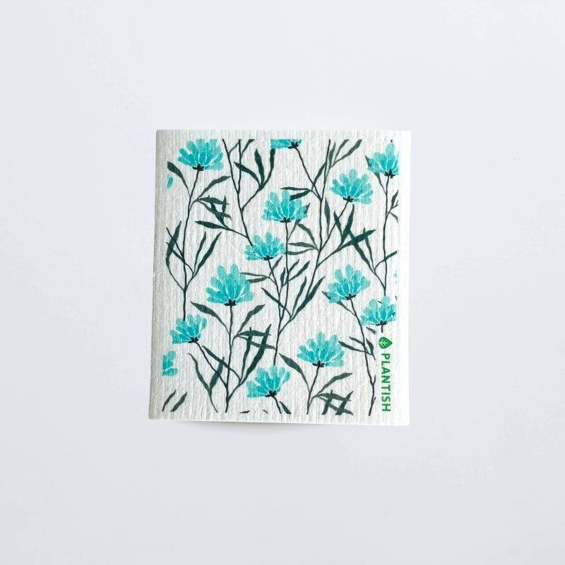 swedish dish cloth wild chicory patterned on a white table top