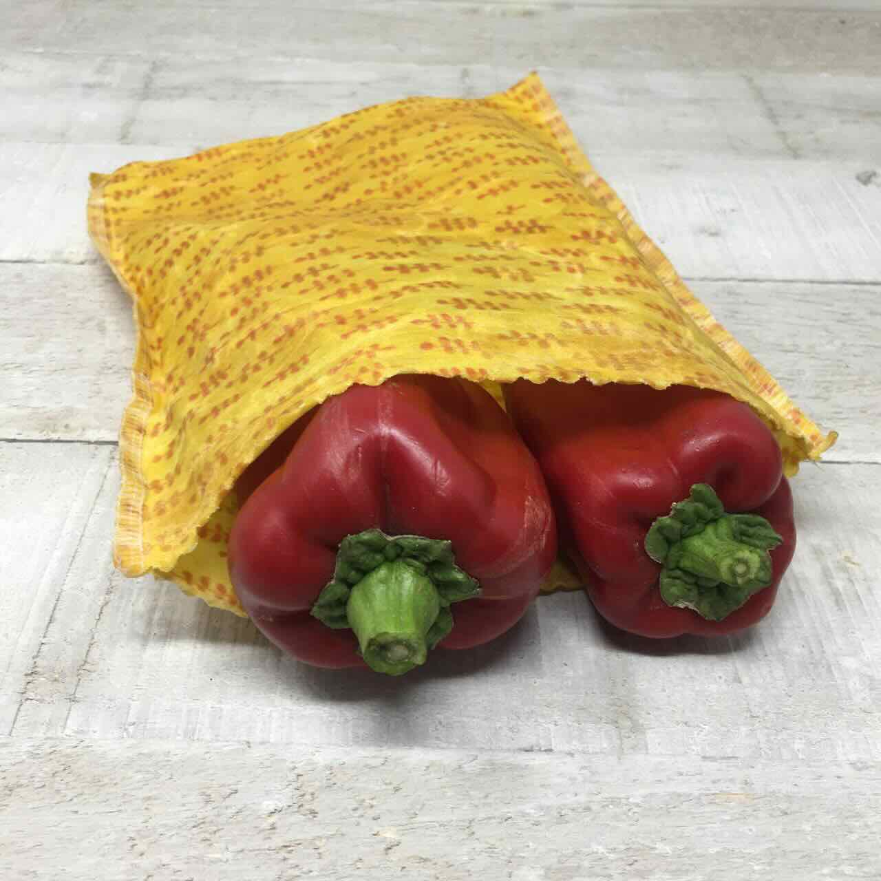 Yellow open beeswax wrap with red pepper